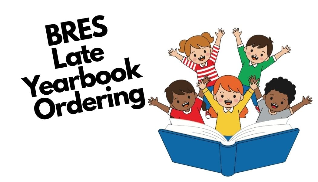 kids happily reading a yearbook